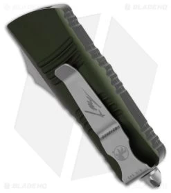 Microtech Mini Troodon Hellhound SS Automatic OTF Knife OD Green (1.9" SW) 7 Microtech Mini Troodon Hellhound SS Automatic OTF Knife OD Green (1.9" SW) -The Family Tools Shop Microtech Mini Troodon Hellhound SS Automatic OTF Knife OD Green 1in SW BHQ 181948 td side
